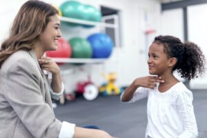 Teacher with child with dysgraphia